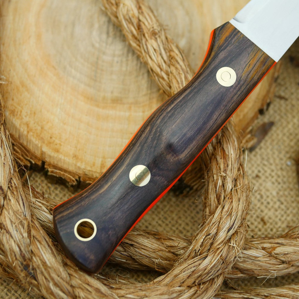 A Voyageur bushcraft knife with cocobolo handle scales and hunter orange g10 liners