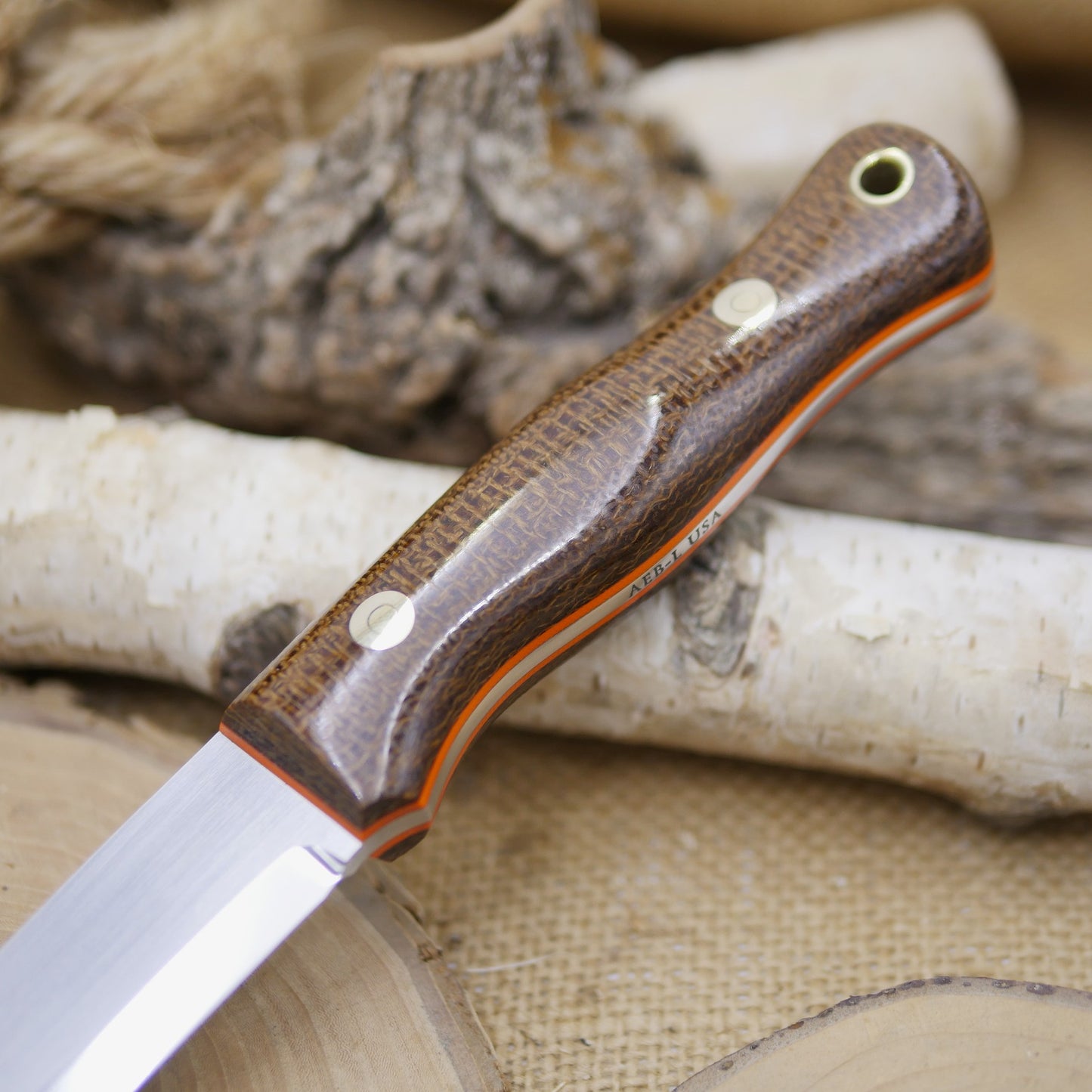 Mountaineer: Dark Brown Burlap Micarta, Orange G10 Liners
