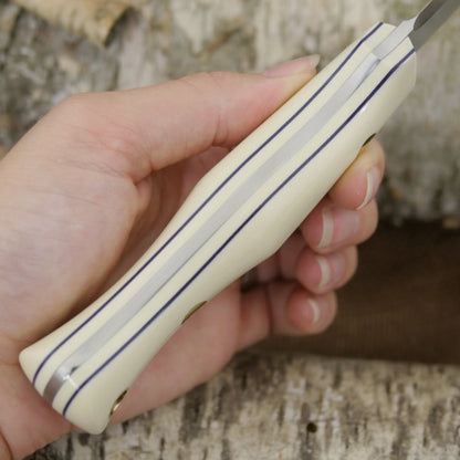 Mountaineer: Ivory G10 & Floating Purple G10