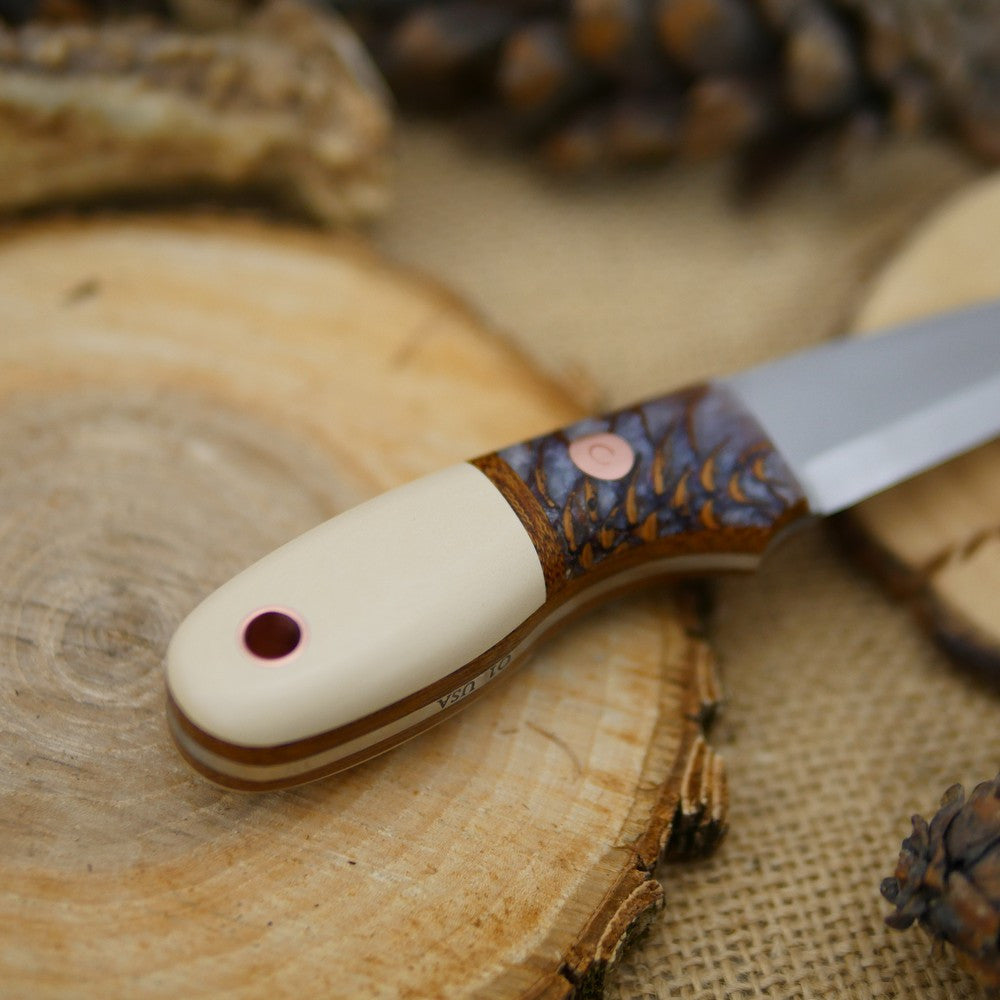 Walker: Ivory paper micarta & Cast Pine Cone