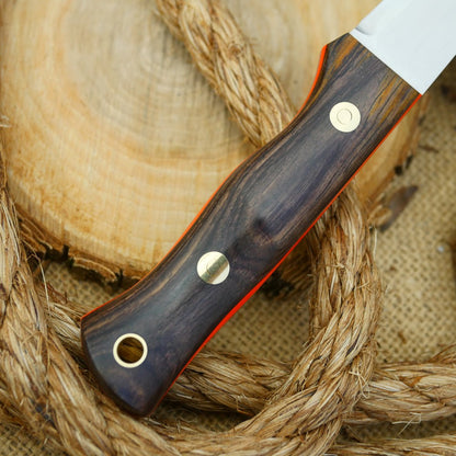 A Voyageur bushcraft knife with cocobolo handle scales and hunter orange g10 liners