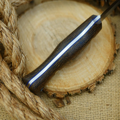 An Adventure Sworn Mountaineer with coffee bag burlap handle scales and thin blue liners